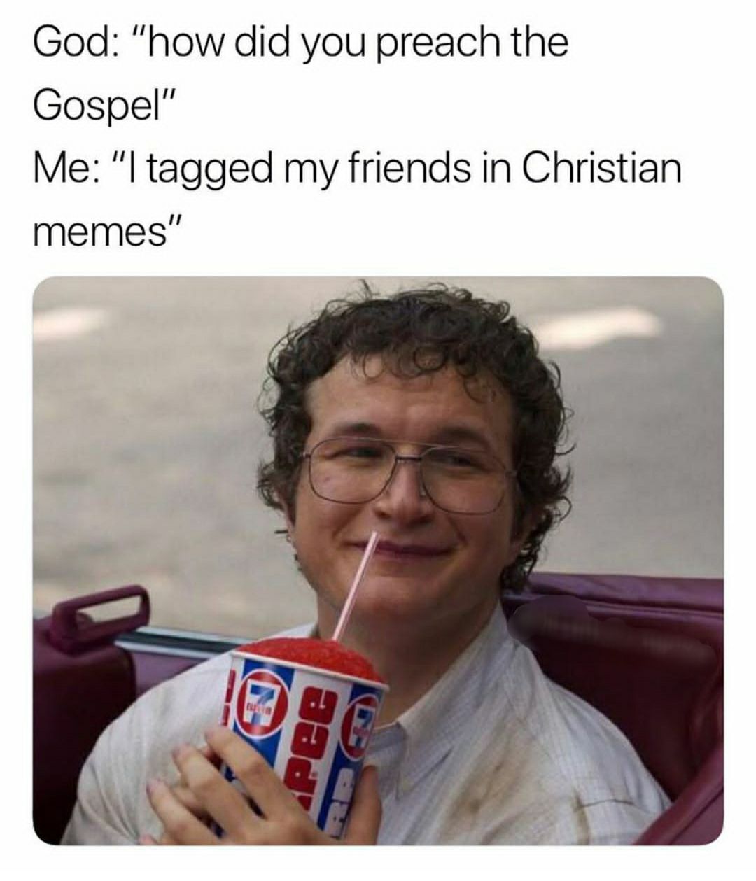 a man with glasses and a drink in his hand